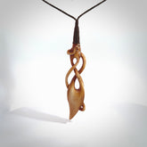 WILDERNESS is carved from cow bone and stained with a homemade tea dye. It is a unique piece of wearable art that is sure to catch the eye. The shape is a complex twist form and has been beautifully hand carved by bone carver Yuri Terenyi.